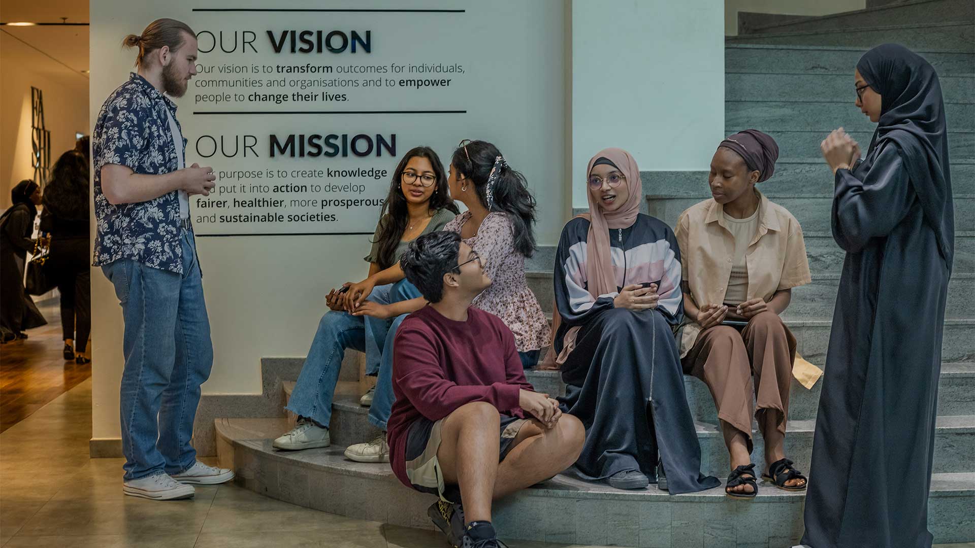 A diverse group of MDX Dubai students on campus